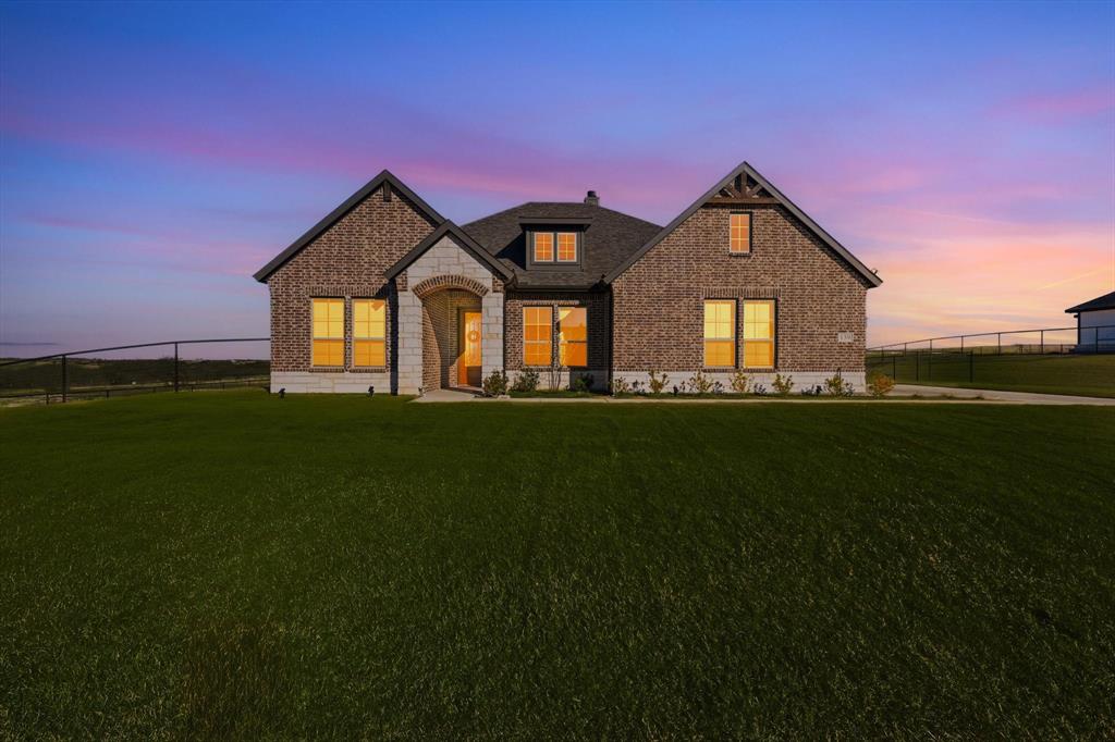 139 Steppes Court Decatur, TX 76234 - Photo 2 of 40 a front view of a house with a yard