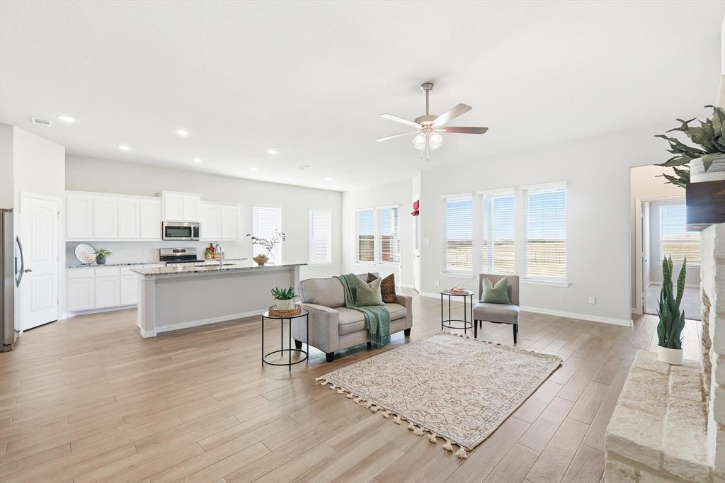 139 Steppes Court Decatur, TX 76234 - Photo 28 of 40 a living room with furniture and kitchen view