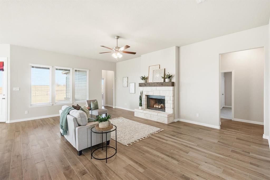 139 Steppes Court Decatur, TX 76234 - Photo 29 of 40 a living room with furniture and a fireplace