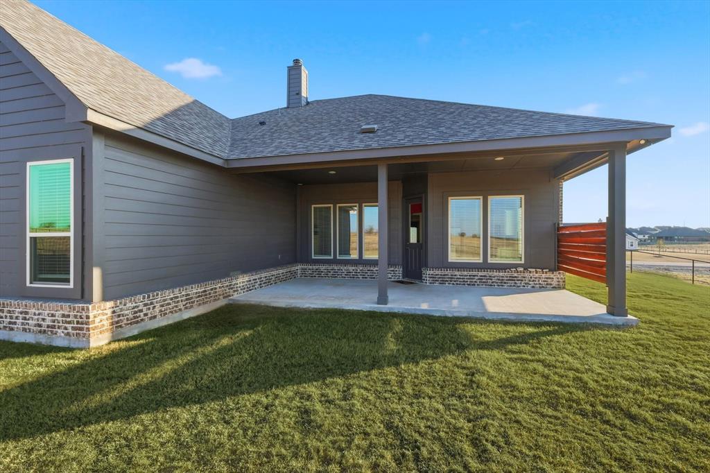 139 Steppes Court Decatur, TX 76234 - Photo 37 of 40 a view of a house with a yard