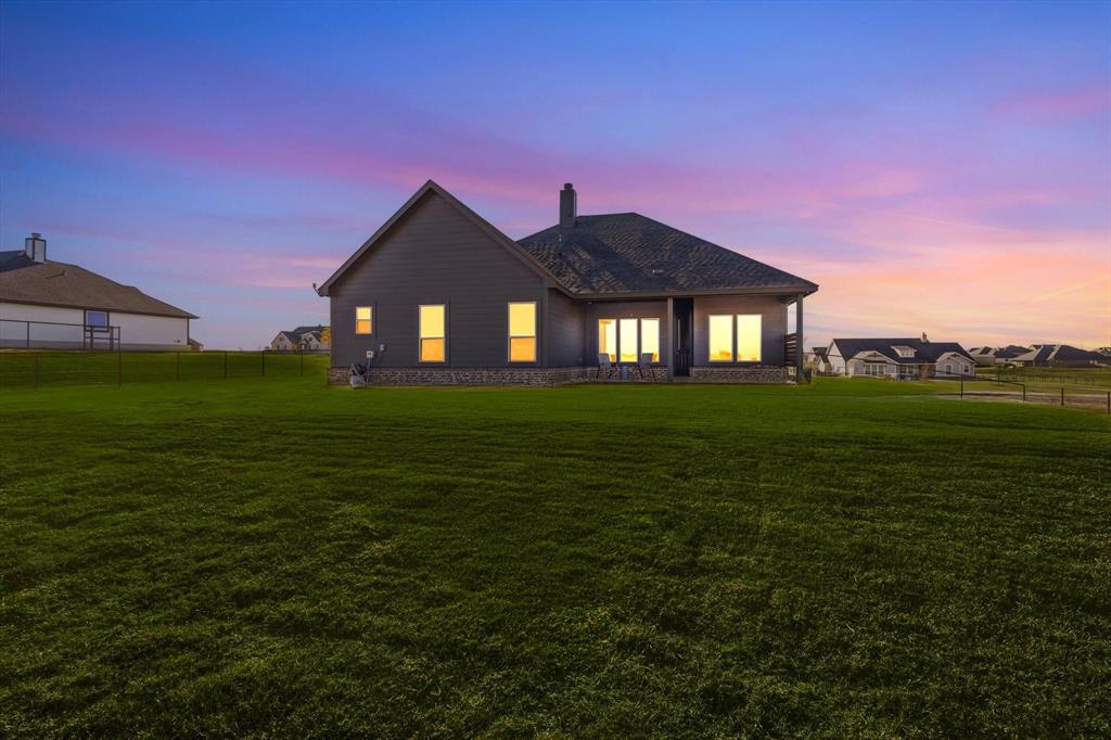 139 Steppes Court Decatur, TX 76234 - Photo 5 of 40 a front view of a house with a yard