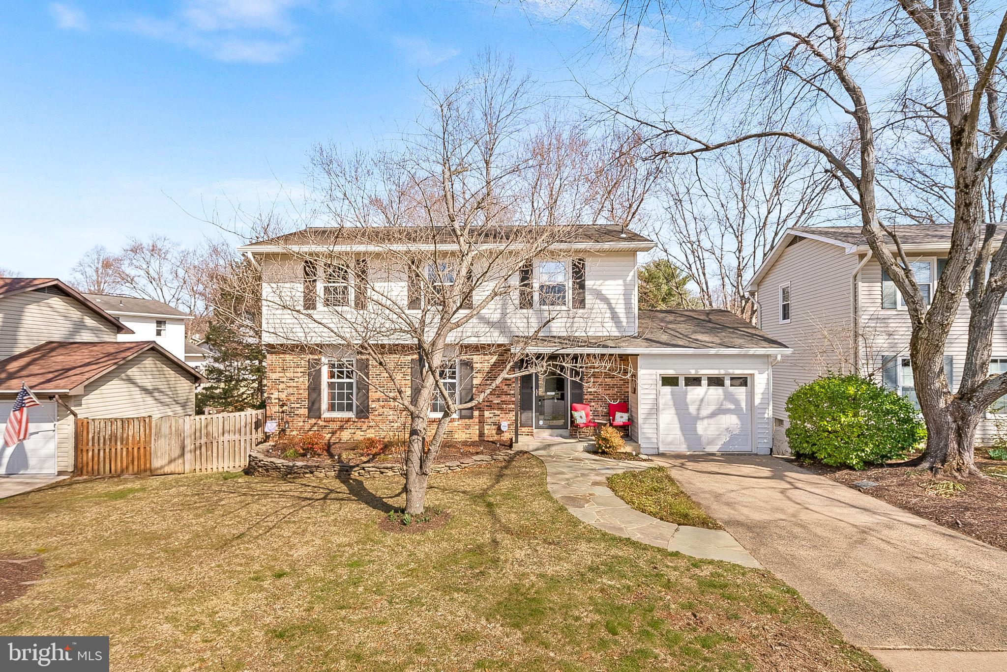 a view of a house with a snow in the yard