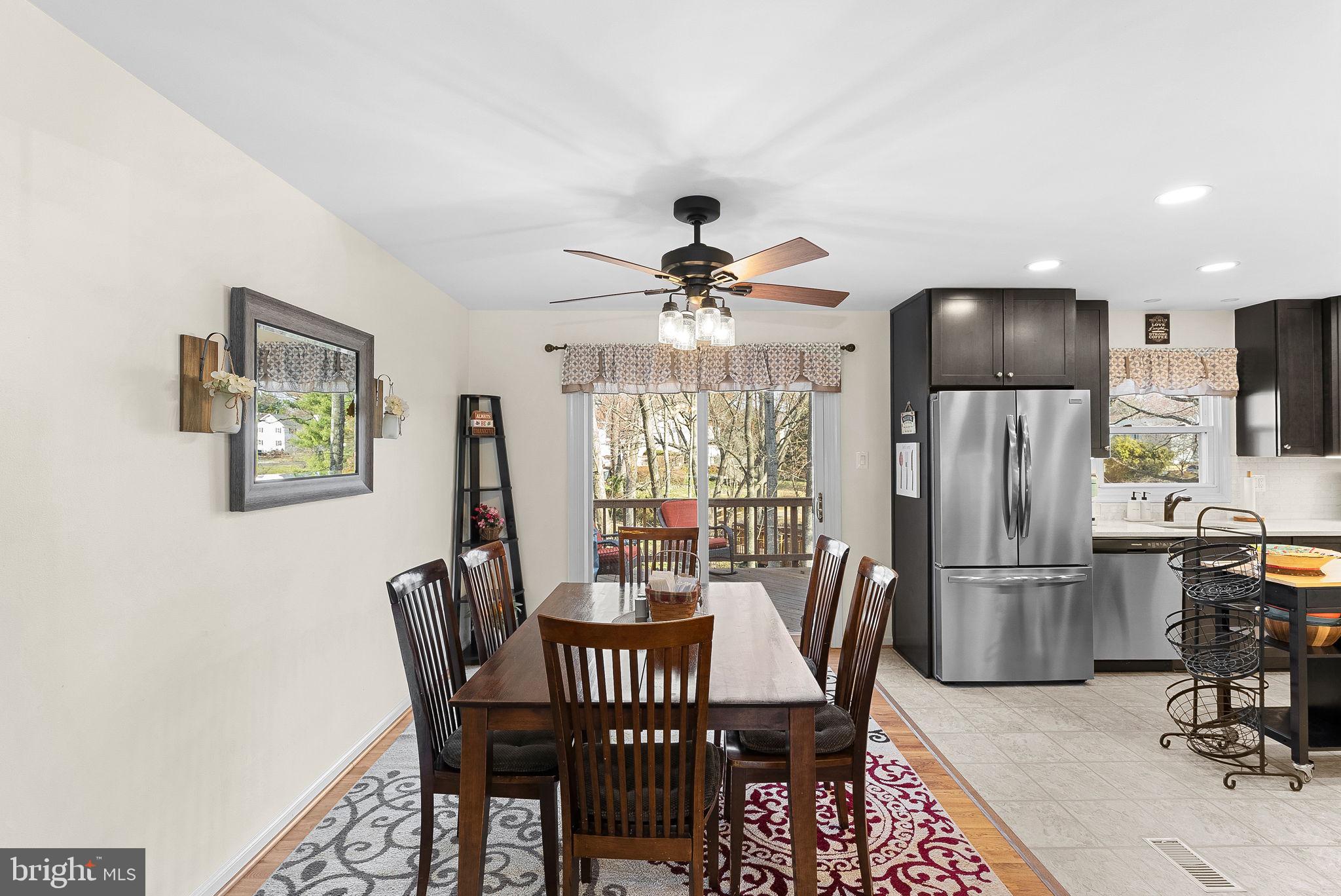 6130 Windward Drive Burke, VA 22015 - Photo 14 of 50 a view of a dining room with furniture window and outside view