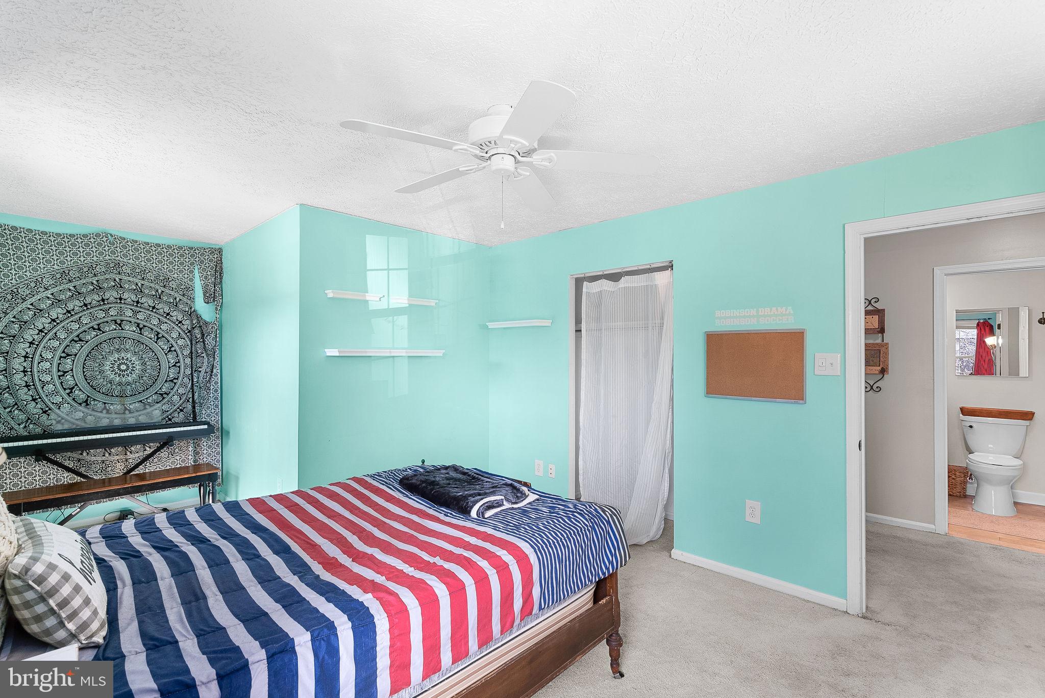 6130 Windward Drive Burke, VA 22015 - Photo 29 of 50 a bedroom with a bed and a painting