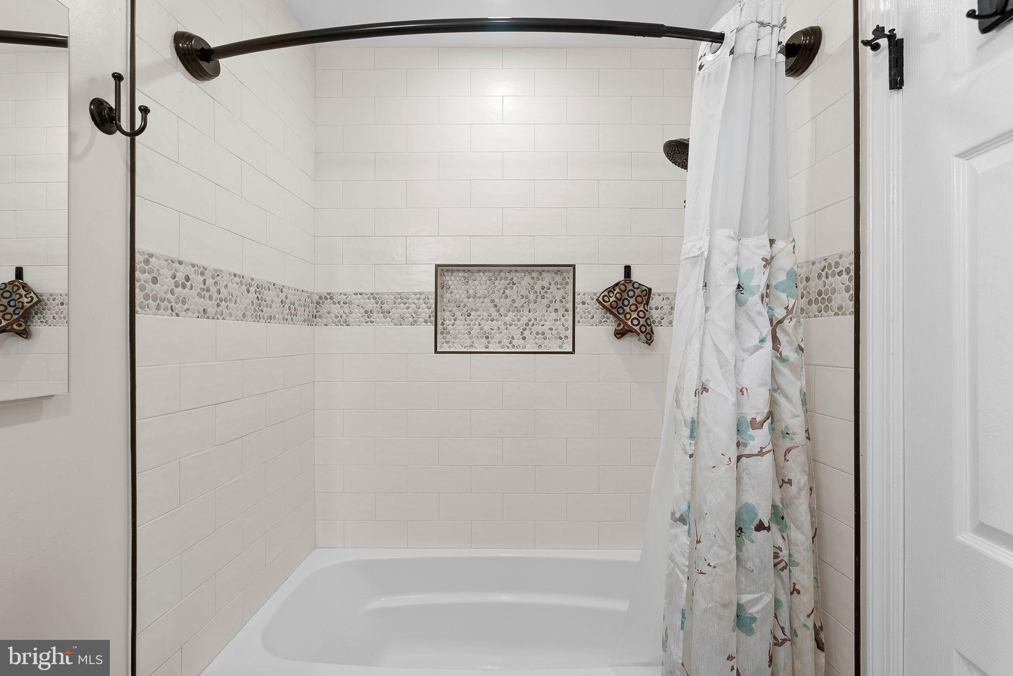 6130 Windward Drive Burke, VA 22015 - Photo 32 of 50 a bathroom with a shower