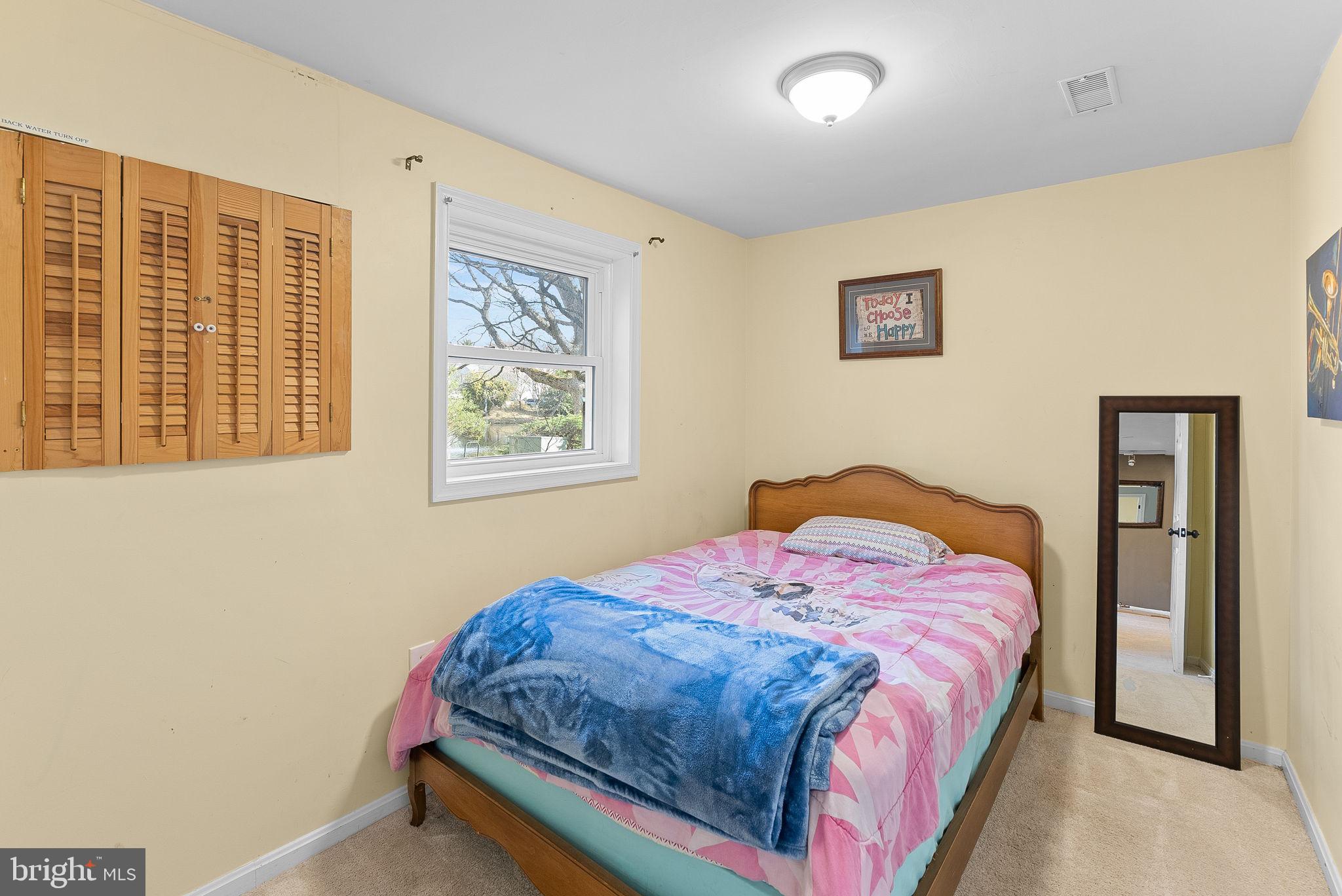 6130 Windward Drive Burke, VA 22015 - Photo 37 of 50 a bedroom with a bed and a window