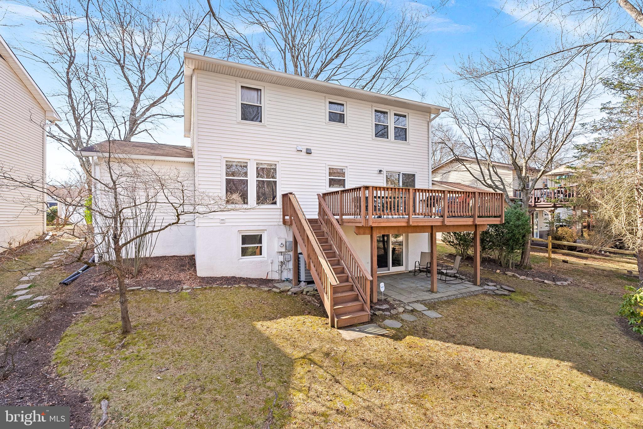6130 Windward Drive Burke, VA 22015 - Photo 45 of 50 a view of a house with a yard covered in snow
