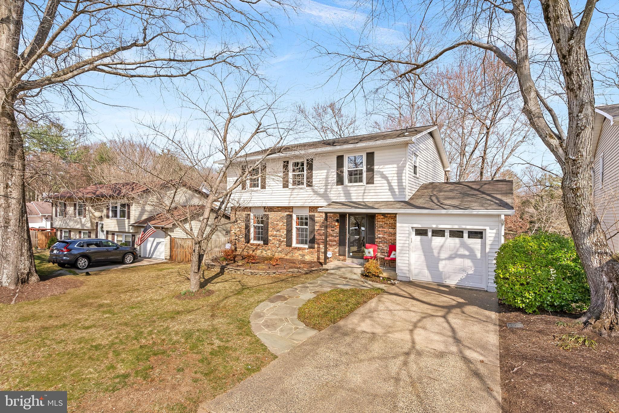 6130 Windward Drive Burke, VA 22015 - Photo 49 of 50 a front view of a house with a yard covered with snow