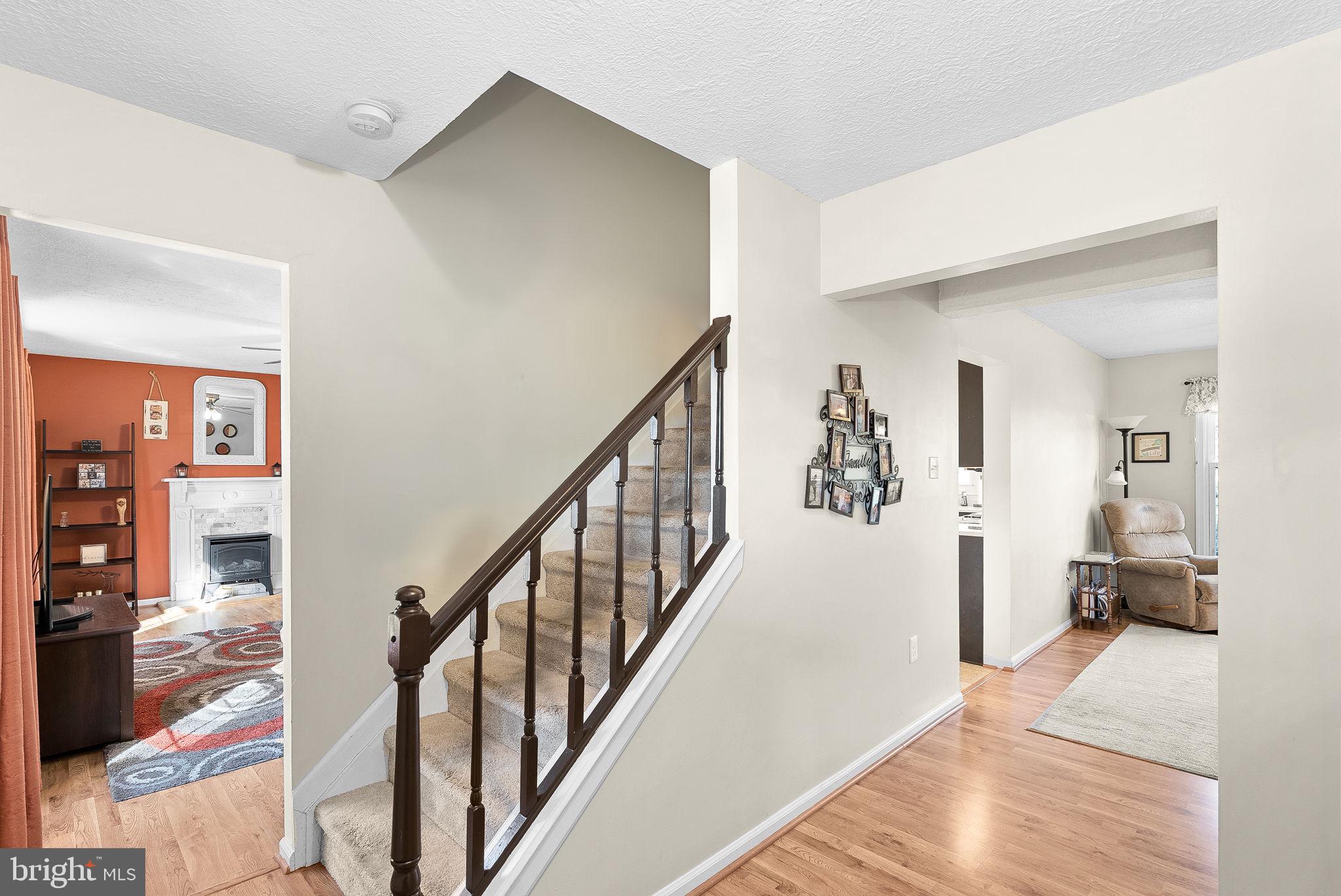 6130 Windward Drive Burke, VA 22015 - Photo 5 of 50 a view of a hallway with bedroom and wooden floor