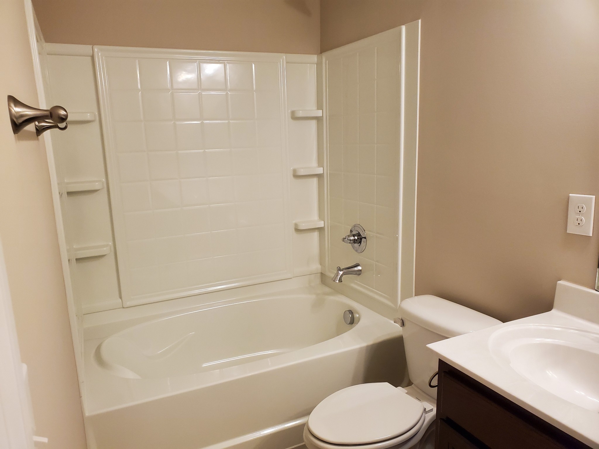 2827 Upstream Road Christiana, TN 37037 - Photo 36 of 54 a white toilet and tub sitting next to a bathroom sink