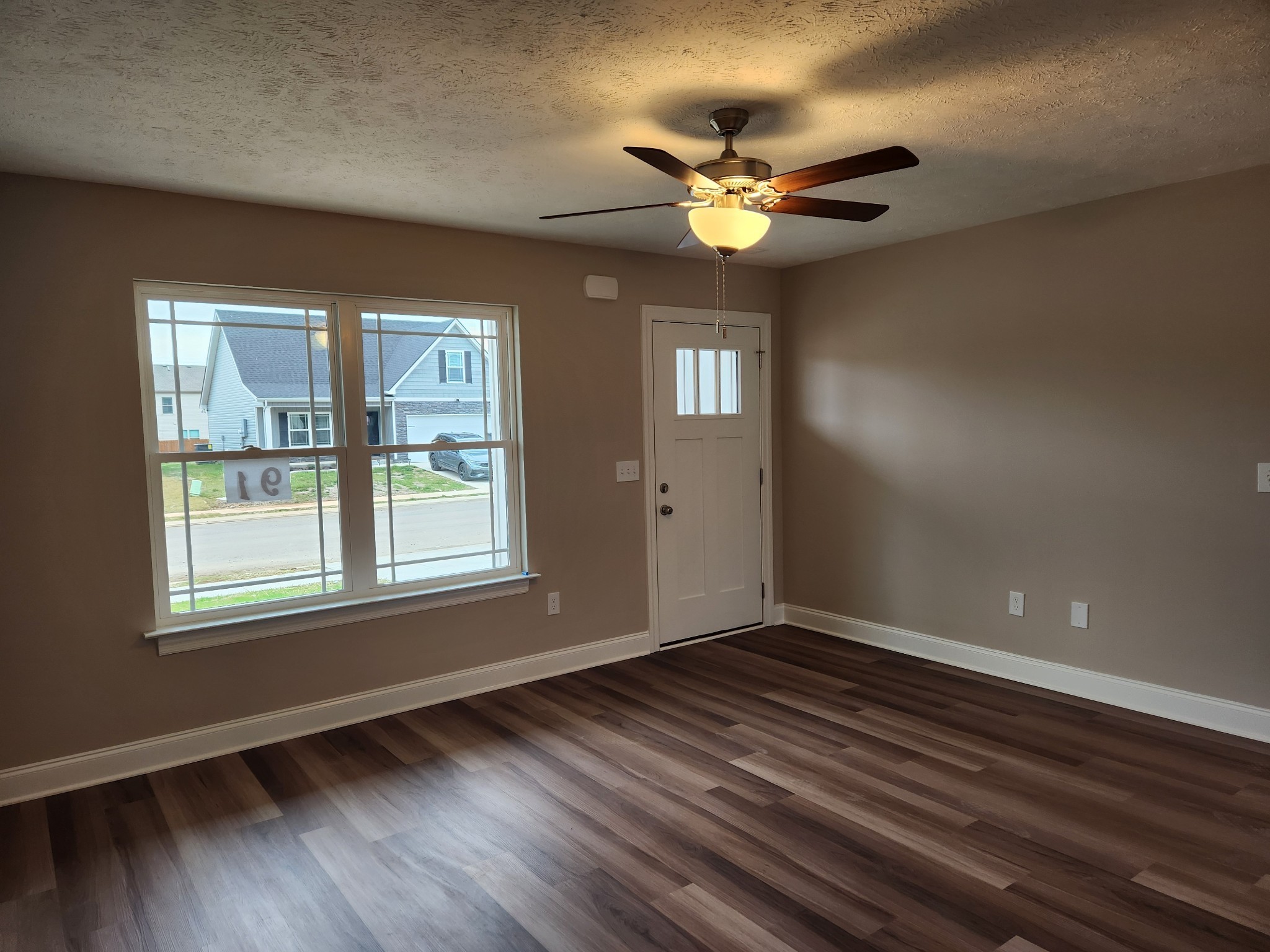 2827 Upstream Road Christiana, TN 37037 - Photo 6 of 54 a view of an empty room with wooden floor and a window
