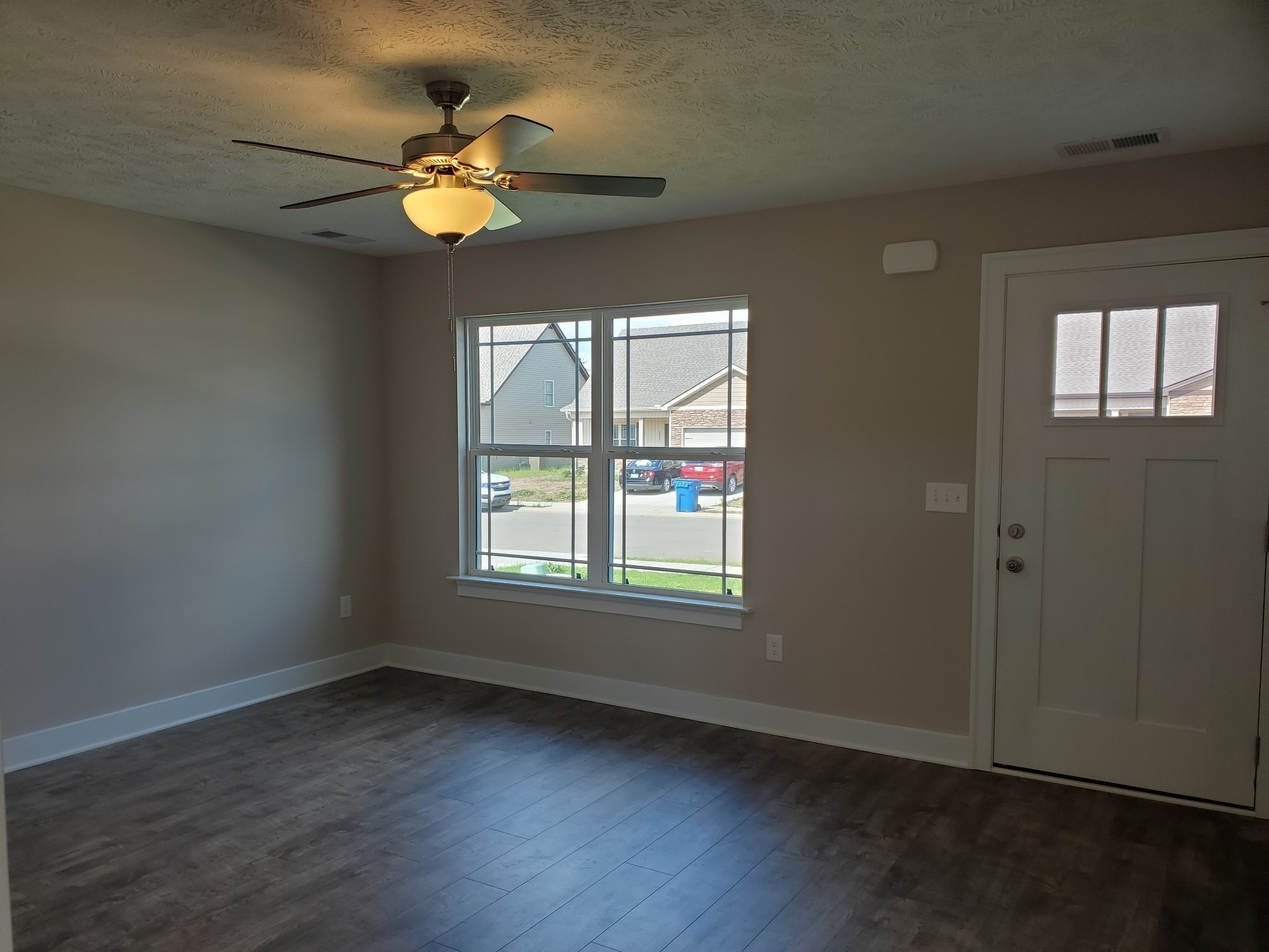 2827 Upstream Road Christiana, TN 37037 - Photo 8 of 54 an empty room with wooden floor and windows