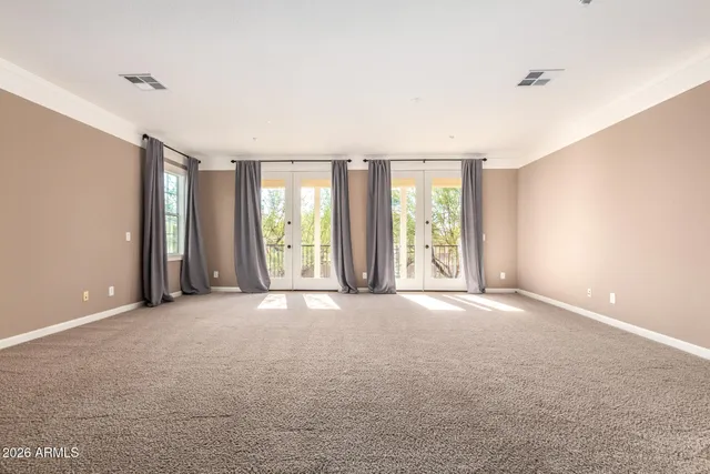 a spacious bathroom with a double vanity sink a mirror and a bathtub