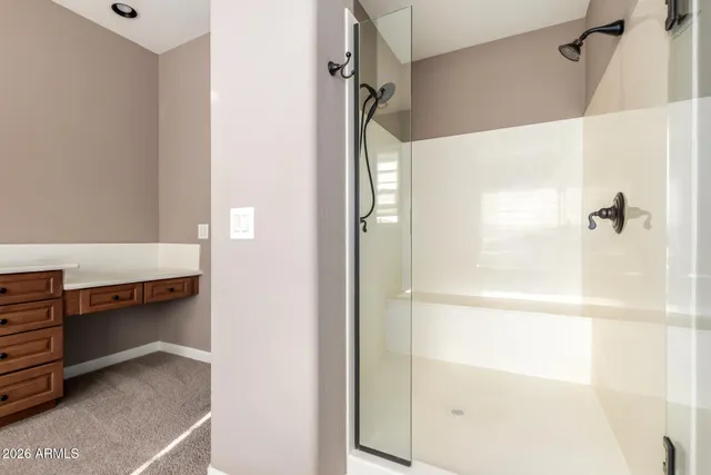 an empty room and window and a ceiling fan