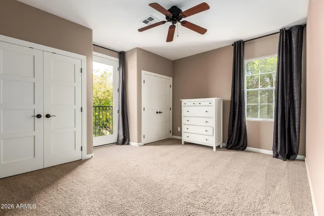 a bathroom with a tub a sink and mirrors