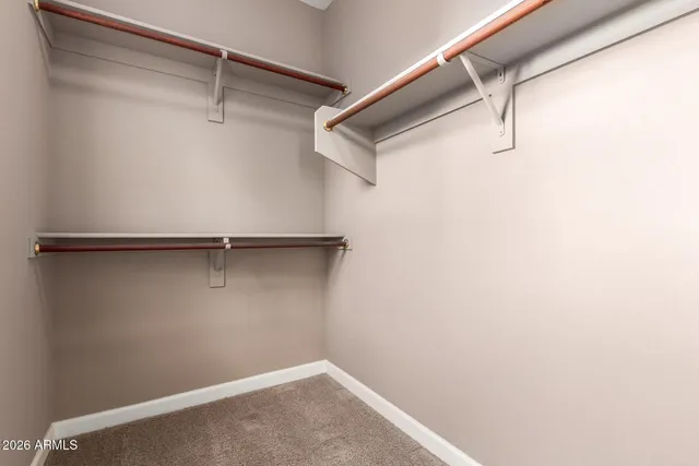 a living room with couches and a large window