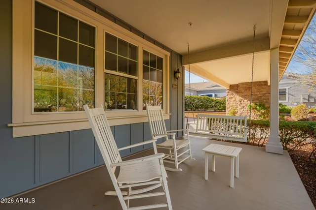 a view of house with swimming pool outdoor seating