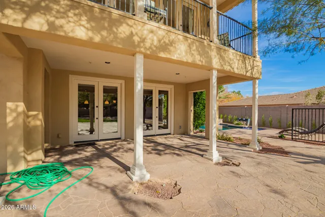a front view of a house with a garden and yard
