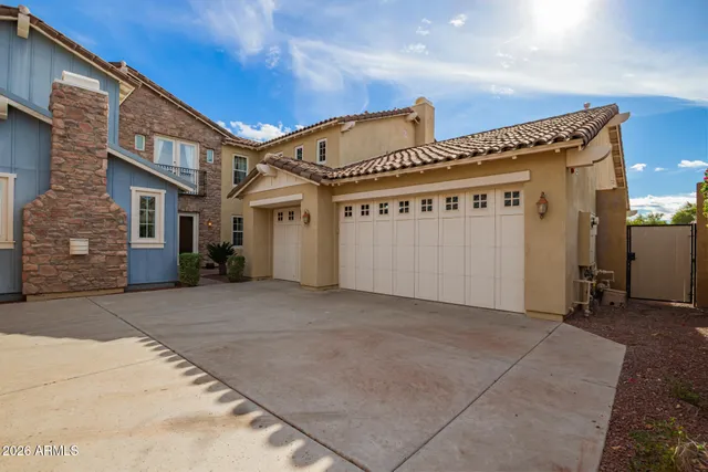 an empty room with windows and fireplace