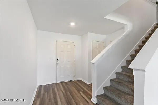 a view of entryway with wooden floor