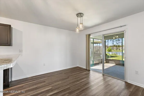 a view of an empty room with glass door