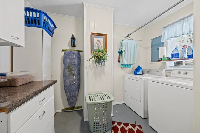 a view of a bedroom with furniture and clothes