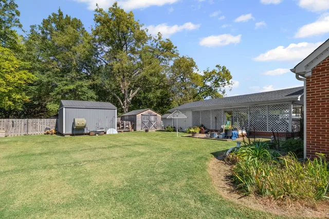 a swimming pool with wooden fence