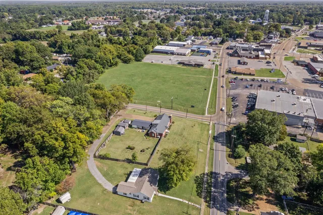 an aerial view of a house with a garden