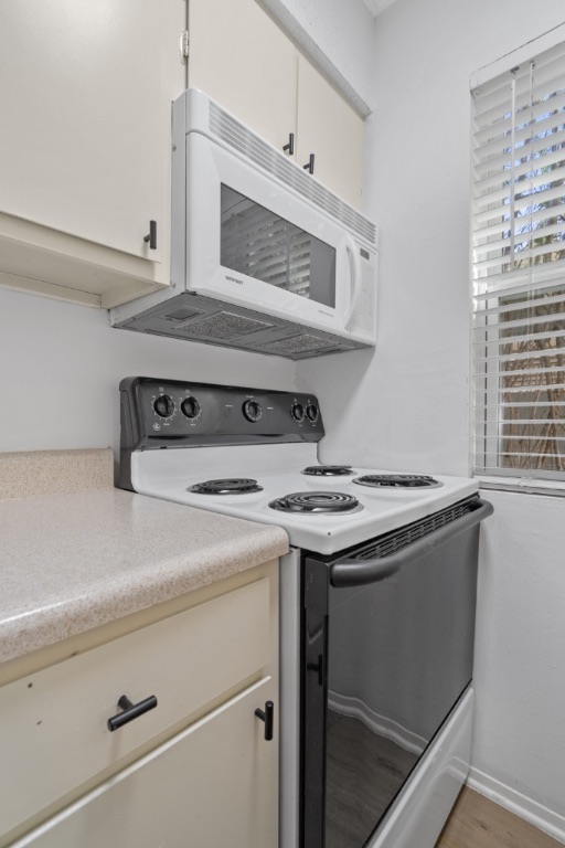 4105 Speedway, Unit 203 Austin, TX 78751 - Photo 3 of 12 a stove top oven sitting inside of a kitchen