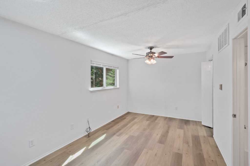 4105 Speedway, Unit 203 Austin, TX 78751 - Photo 6 of 12 a view of a room with wooden floor and fan