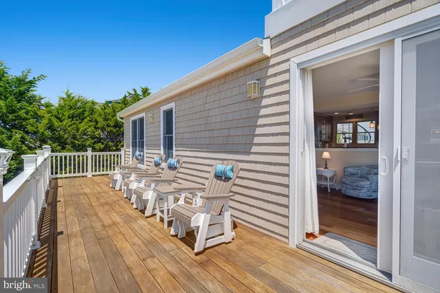 a view of a house with a deck and a garden