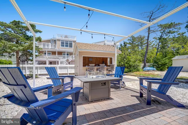 a view of a backyard with furniture and a patio