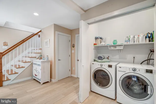 an aerial view of multiple houses with yard