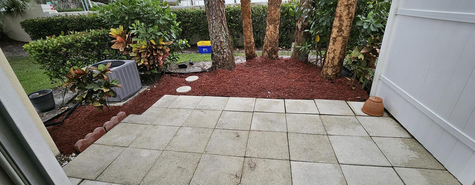 13490 Old Englishtown Road Wellington, FL 33414 - Photo 11 of 13 a view of a backyard with sitting area