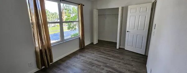 a view of front door with wooden floor