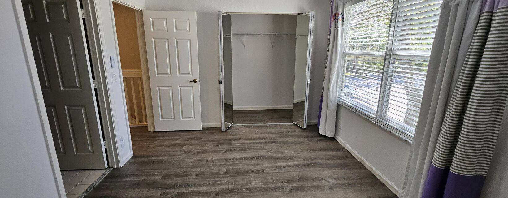 13490 Old Englishtown Road Wellington, FL 33414 - Photo 6 of 13 a view of a hallway with wooden floor and staircase