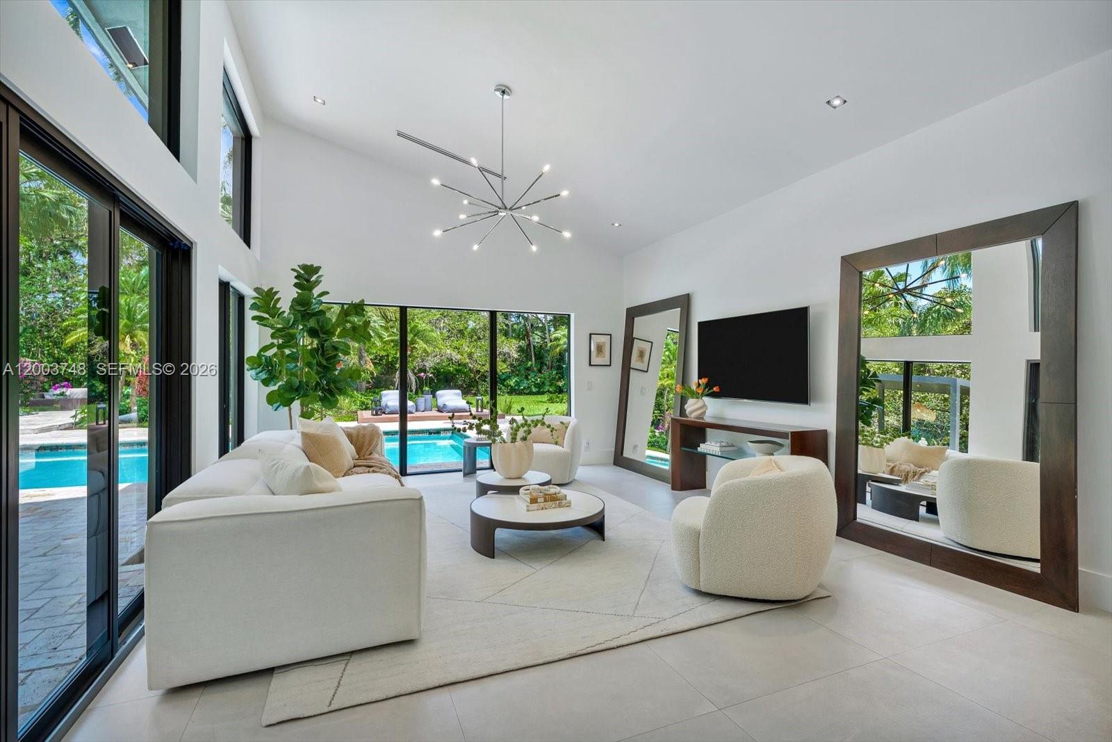 2675 Hackney Road Weston, FL 33331 - Photo 17 of 61 a living room with furniture and a flat screen tv