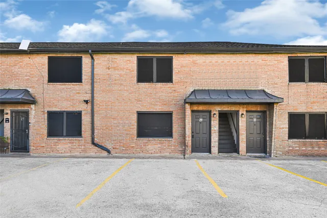 a front view of a house with yard