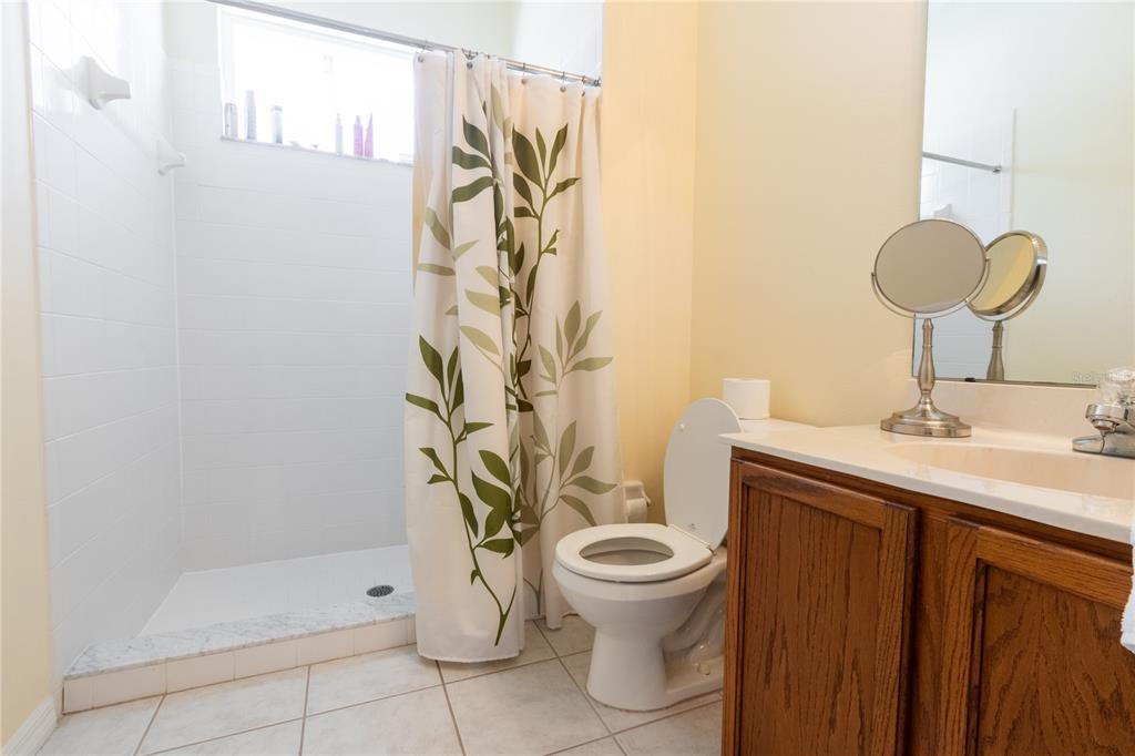 1812 Flower Branch Way Valrico, FL 33594 - Photo 29 of 42 a bathroom with a toilet sink and shower
