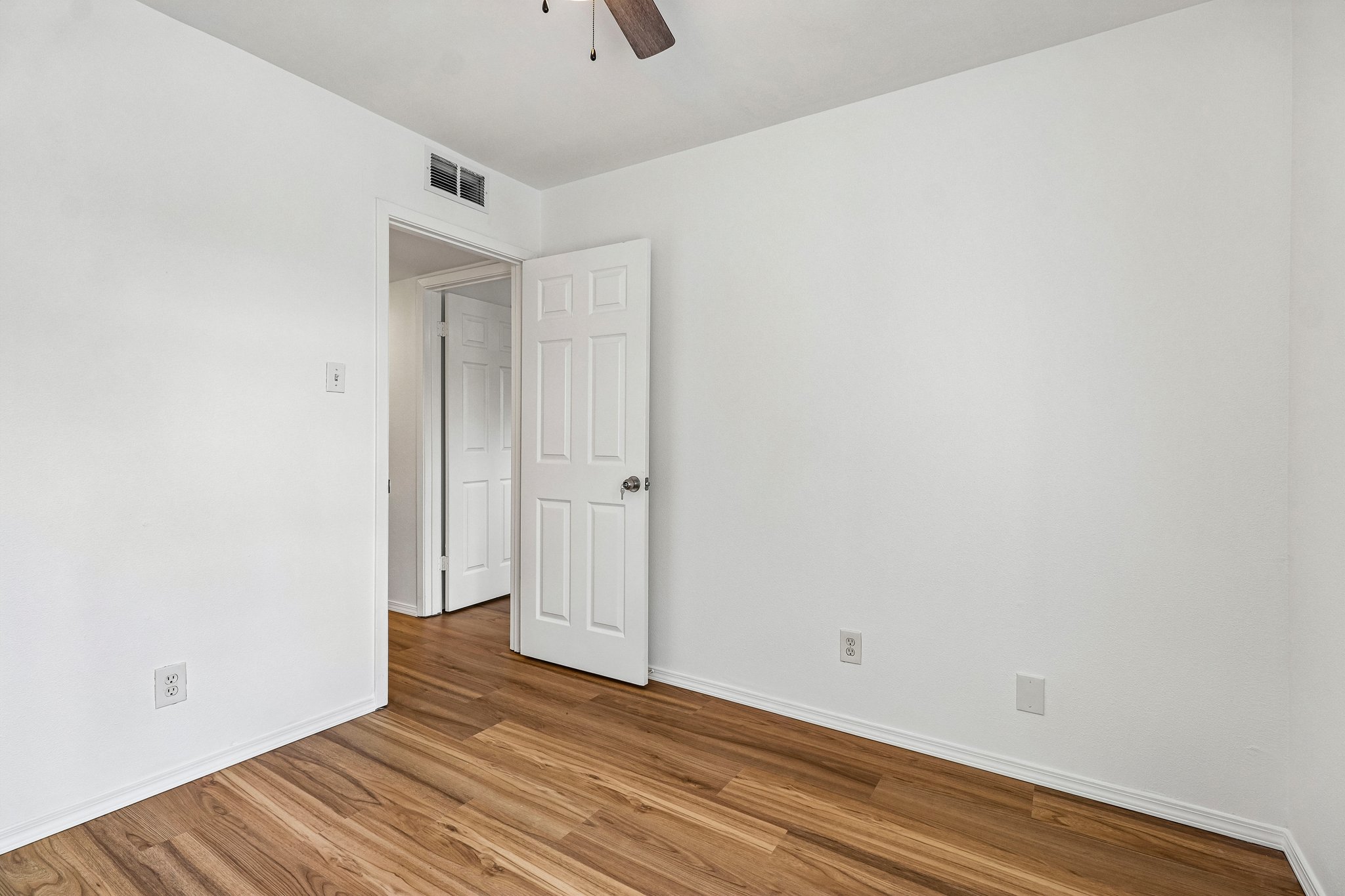 5809 Coventry Lane Austin, TX 78723 - Photo 18 of 35 Natural wood flooring complements this generously proportioned interior space, ready for your personal touch.