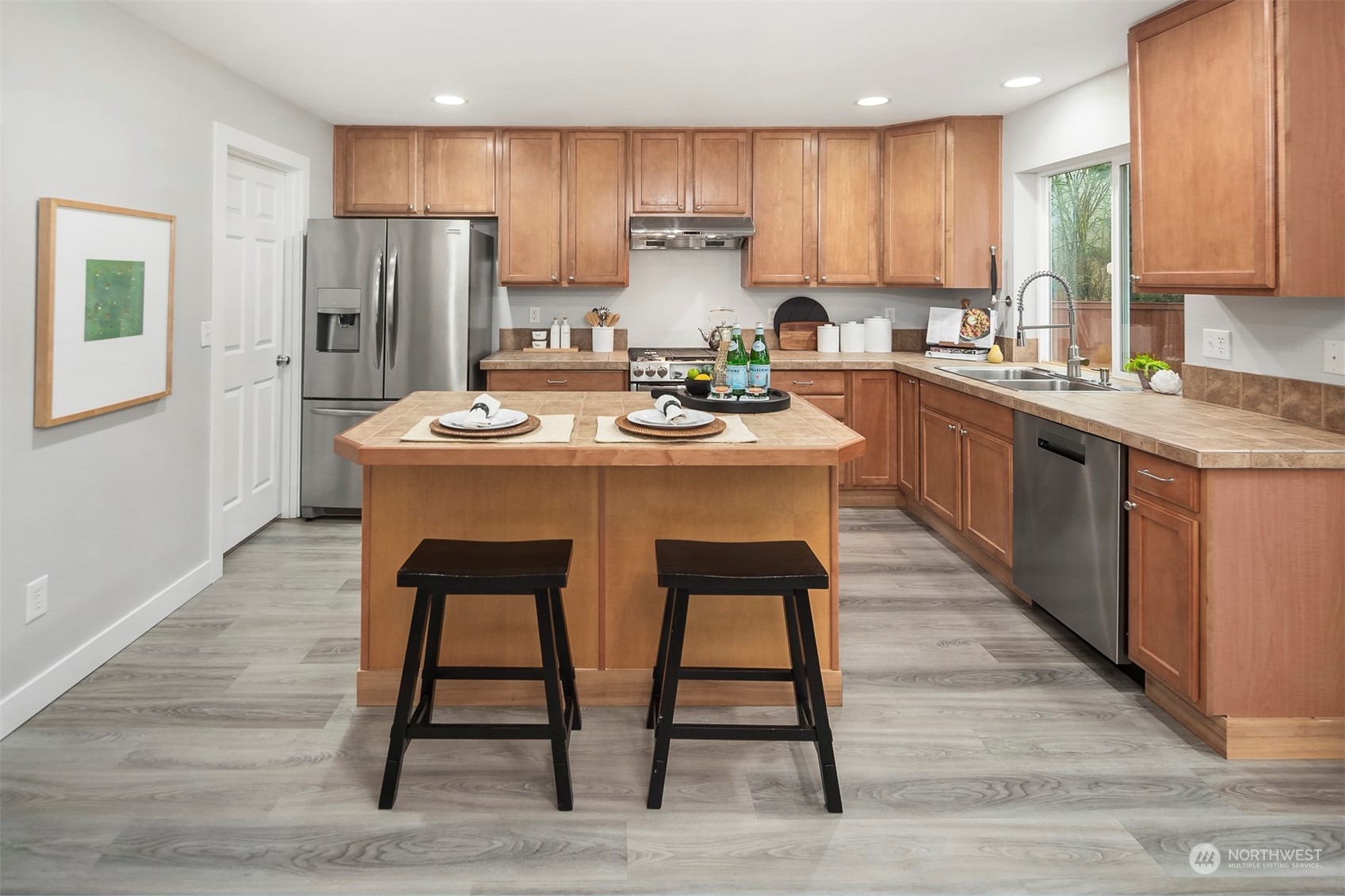 3205 Southeast 4th Street Renton, WA 98056 - Photo 13 of 38 a kitchen with refrigerator cabinets and chairs