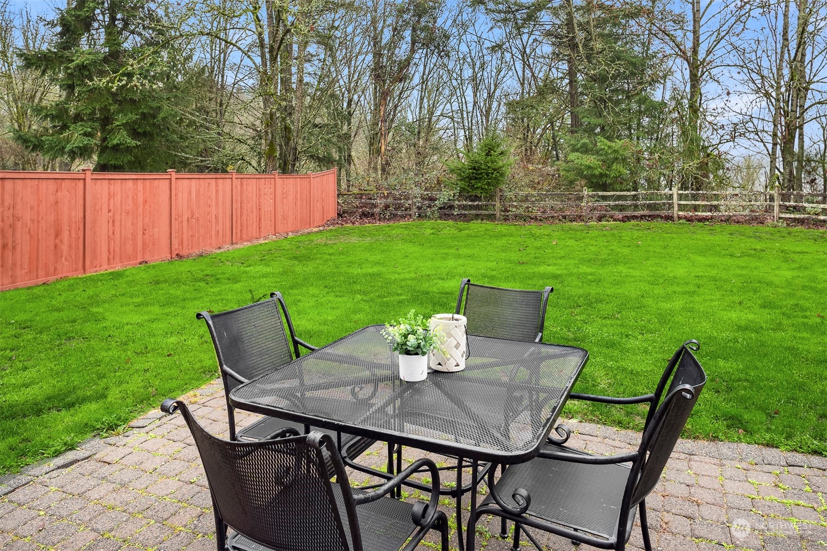 3205 Southeast 4th Street Renton, WA 98056 - Photo 35 of 38 a view of a dining table and chairs in the garden