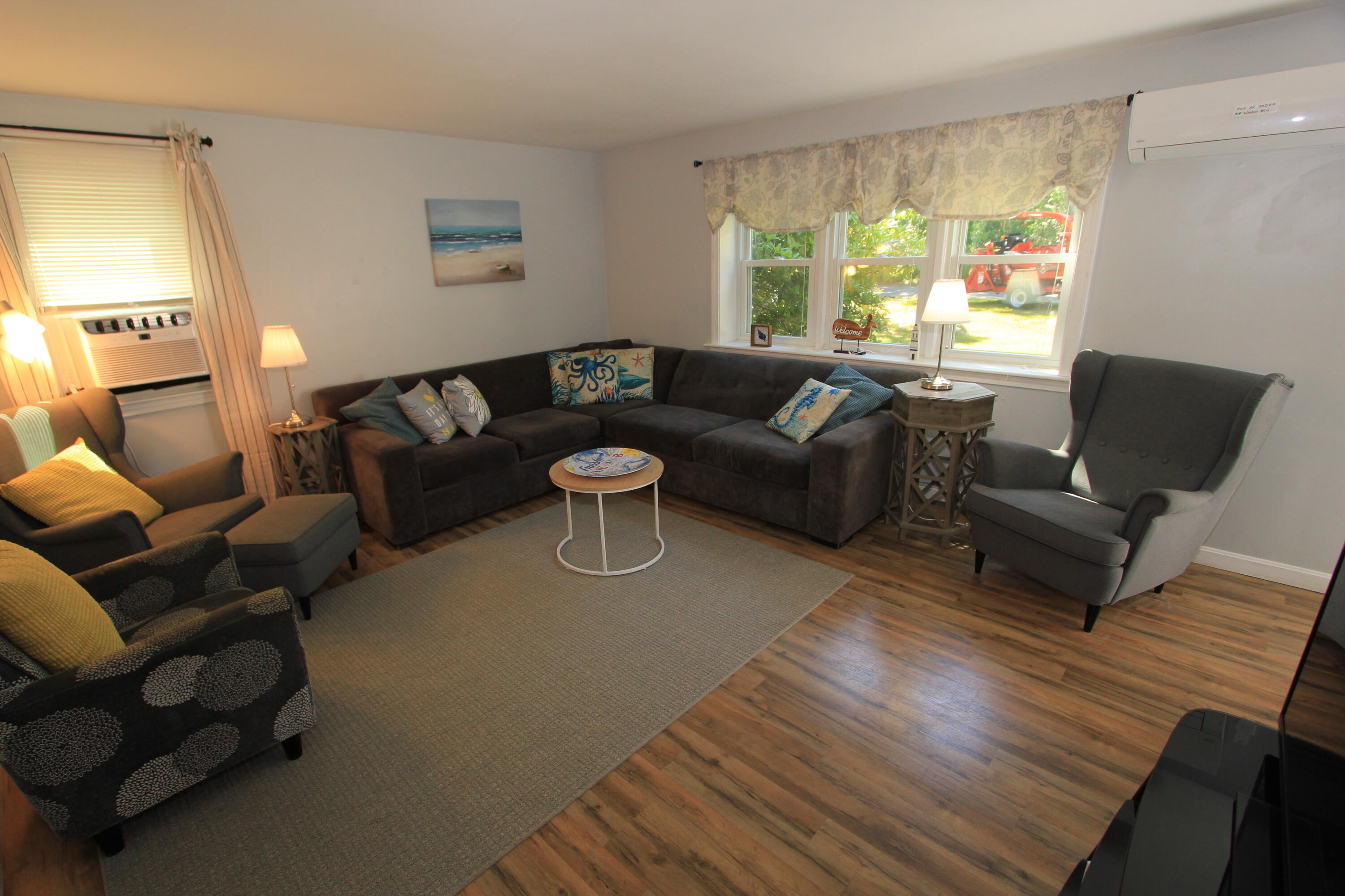 23 Nauset Road Sagamore Beach, MA 02562 - Photo 2 of 13 a living room with furniture and a large window