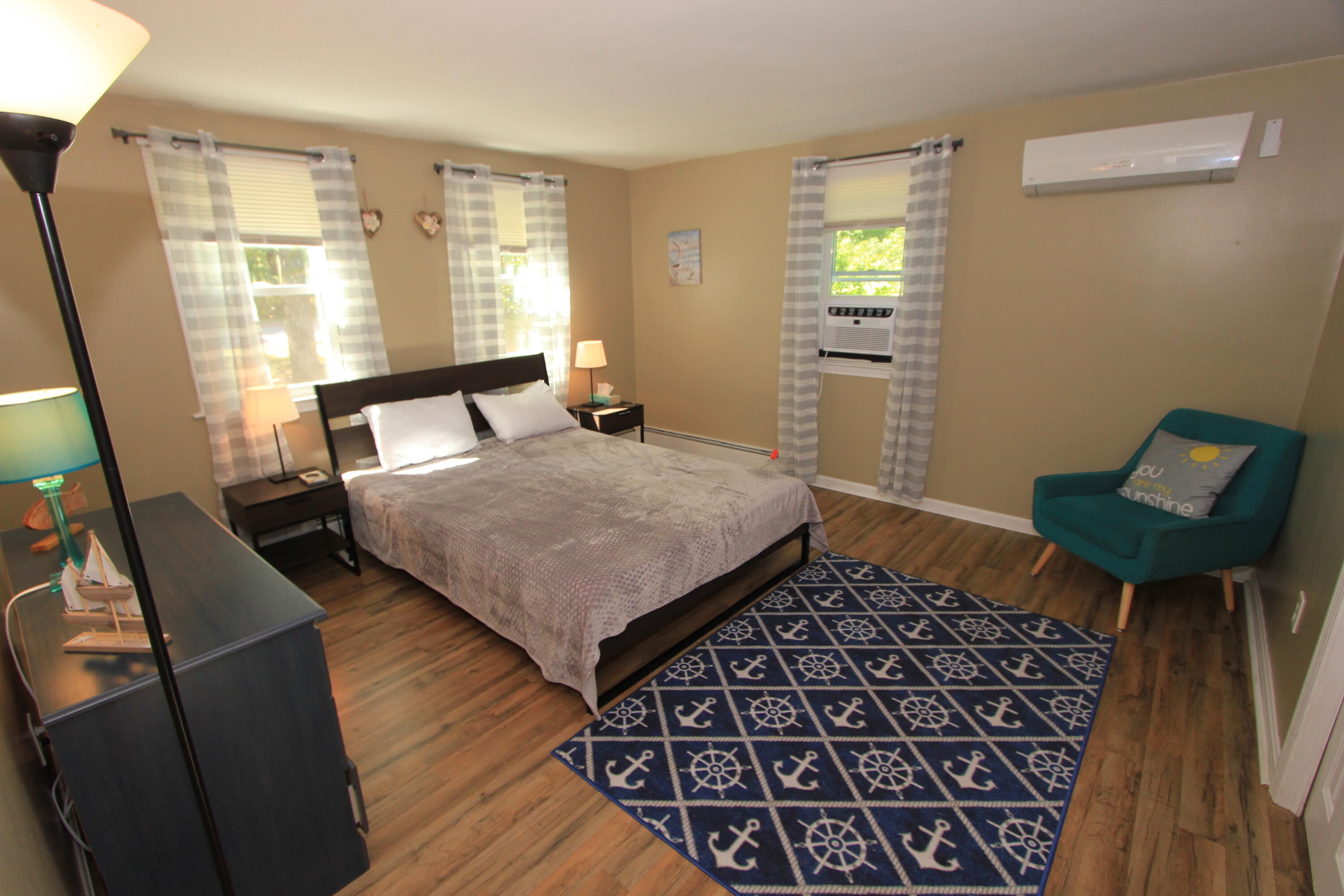 23 Nauset Road Sagamore Beach, MA 02562 - Photo 4 of 13 a bedroom with a bed window and a mirror