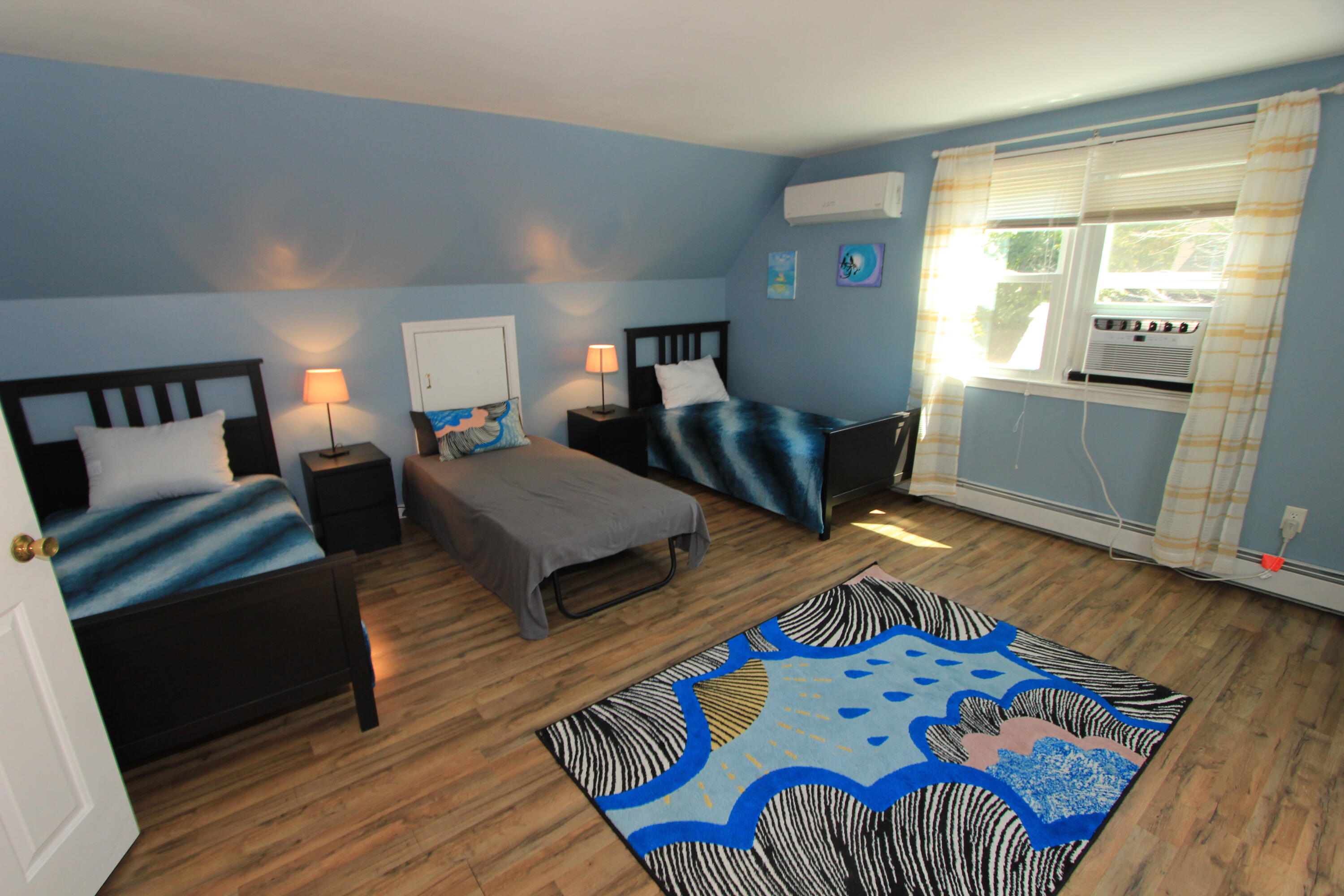 23 Nauset Road Sagamore Beach, MA 02562 - Photo 7 of 13 a bedroom with furniture and a wooden floor
