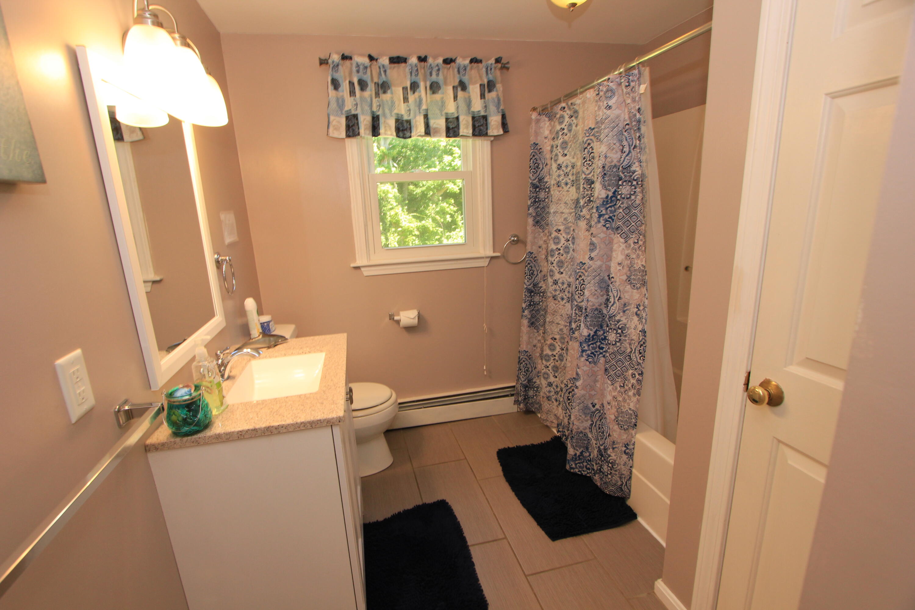 23 Nauset Road Sagamore Beach, MA 02562 - Photo 8 of 13 a bathroom with a bathtub and shower