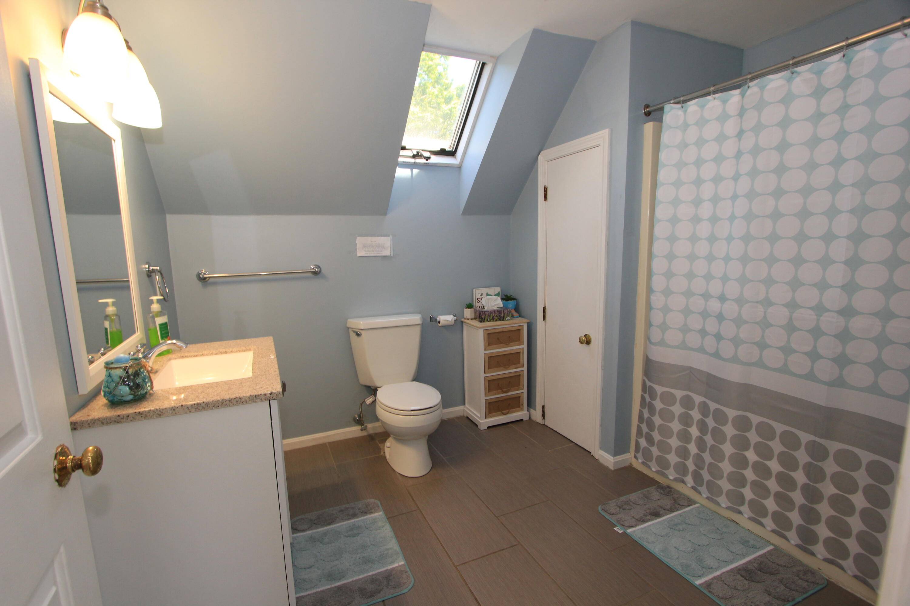 23 Nauset Road Sagamore Beach, MA 02562 - Photo 9 of 13 a white toilet sitting next to a bathroom sink