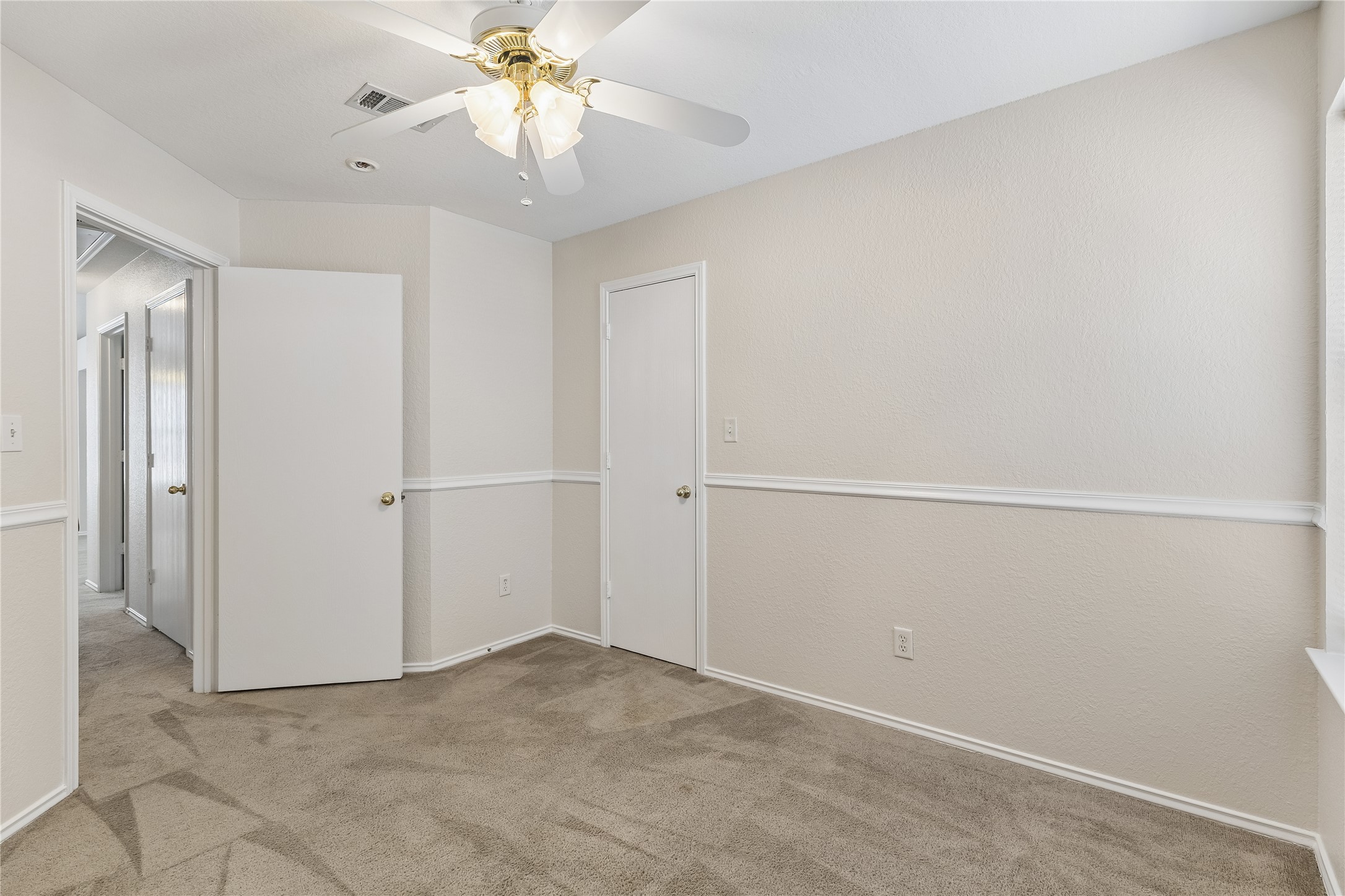 104 Cavalry Trail Elgin, TX 78621 - Photo 16 of 26 Bedroom 2 with a small walk in closet.