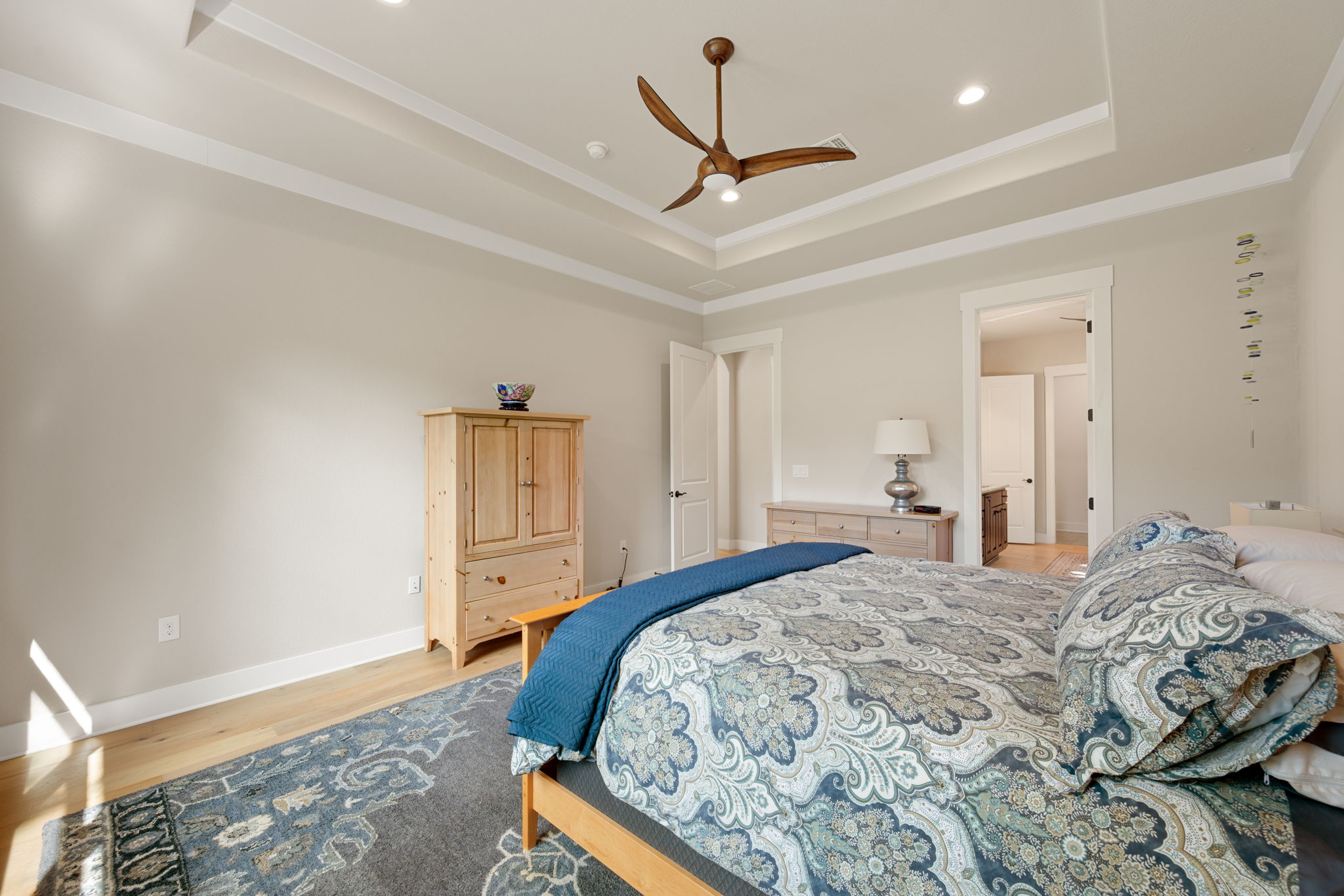 212 Marbella Way Georgetown, TX 78633 - Photo 19 of 40 a bedroom with a bed and a dresser
