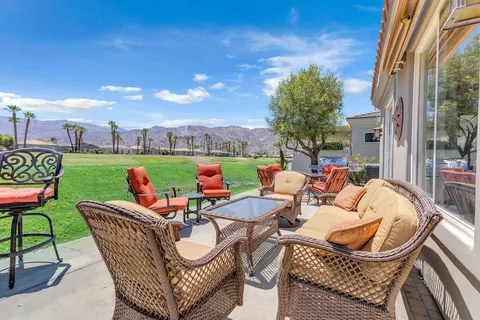 a outdoor living space with furniture and garden view